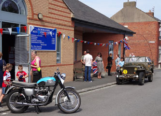 Photo 9  - 2013 Exhibition - Kester Marsh’s gleaming Classic Motorbike joins the jeep.